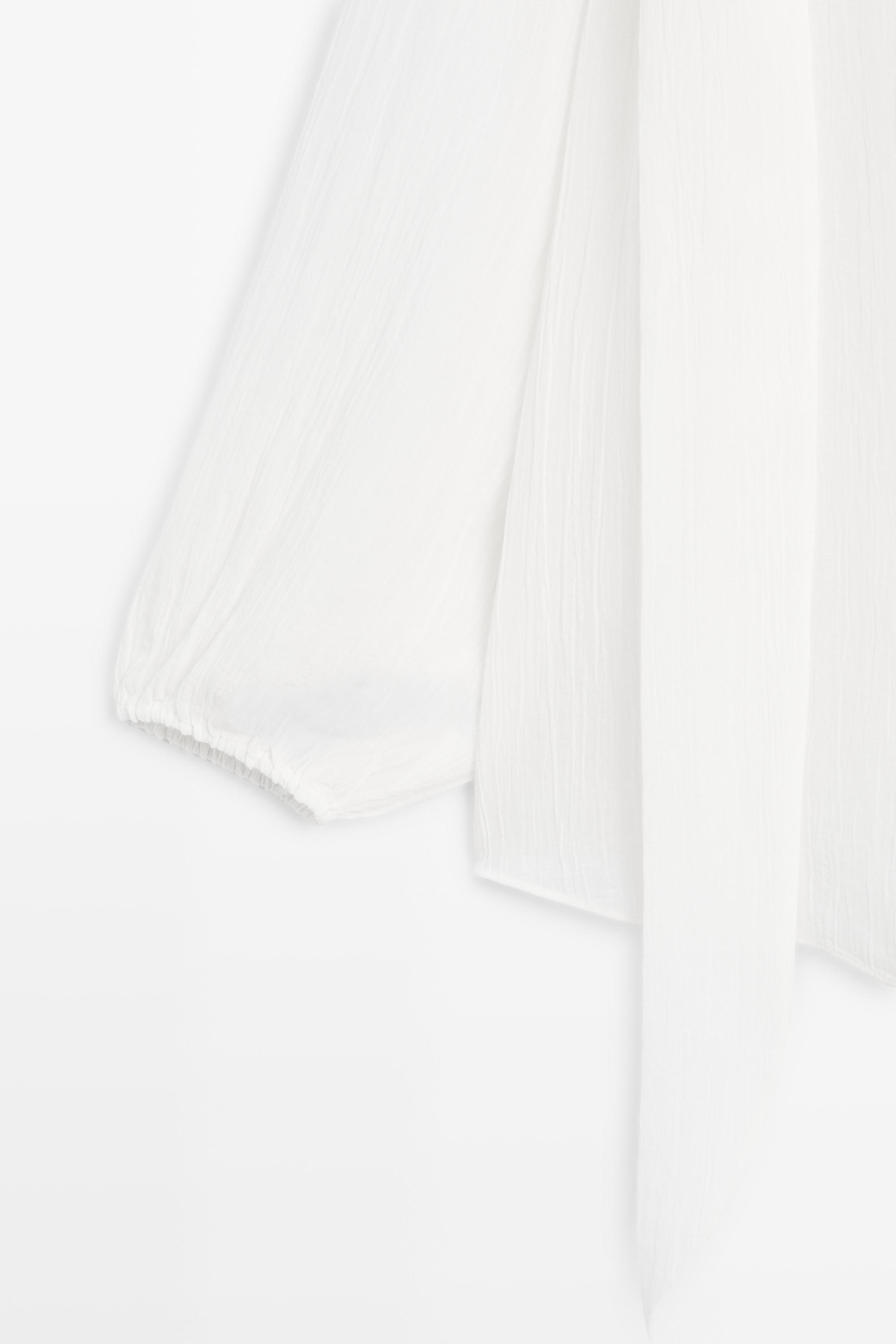Blouse fluide col en V avec nœud